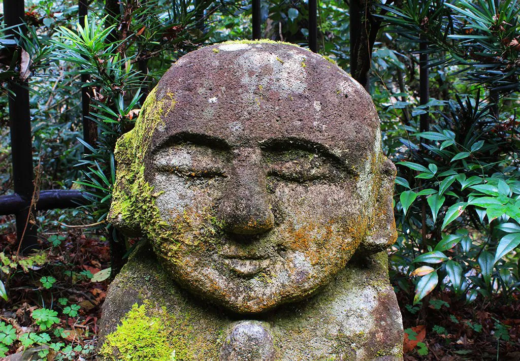 Stone Buddha praying