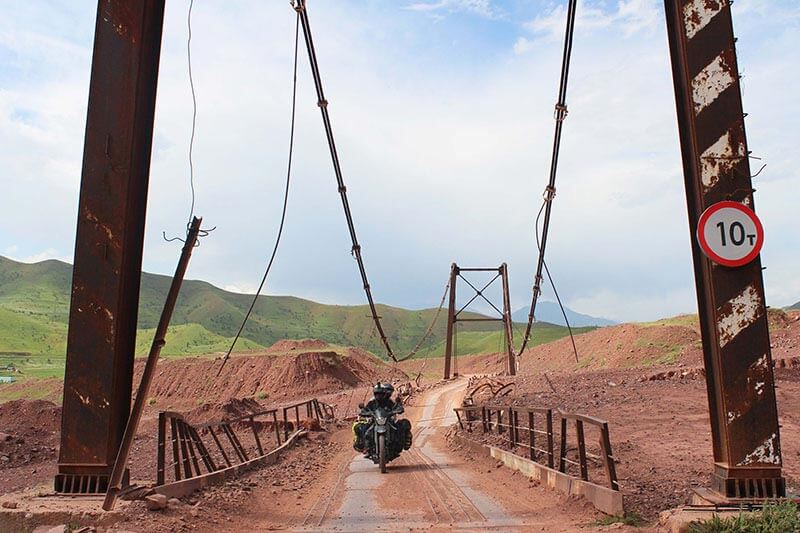 Mad or Nomad motorcycle travel in Tajikistan Pamir Mountains bridge